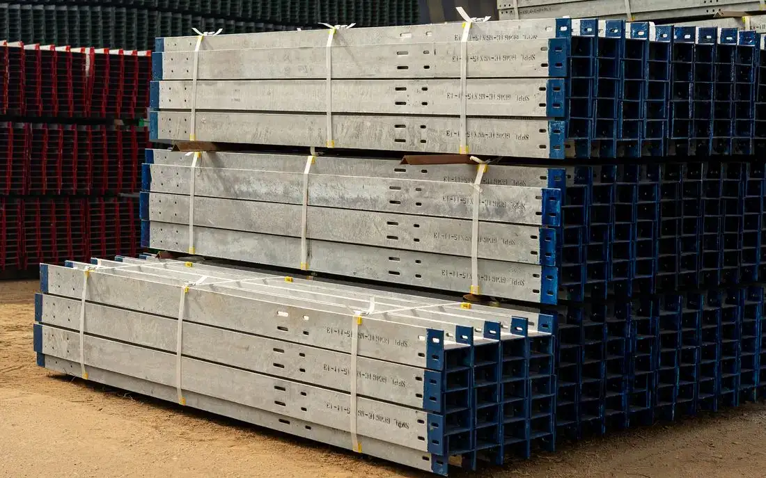 Steel beams stacked in a supplier yard ready for delivery